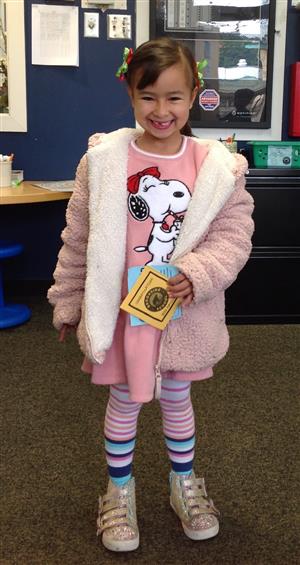 student with bear badge 